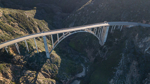 Bridge over road against mountain