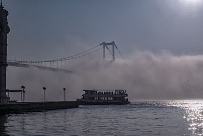 Scenic view of bridge over sea against sky