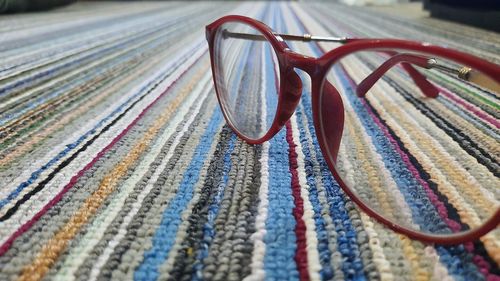 Close-up of eyeglasses on rug