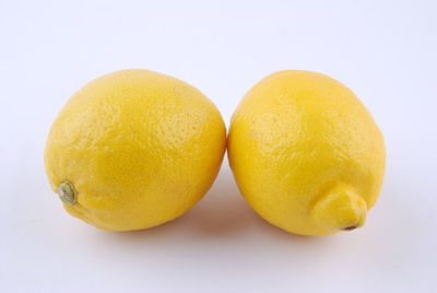 Close-up of oranges against white background