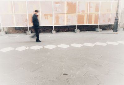 Full length of man walking in corridor