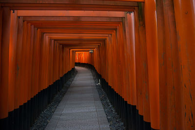 Beautiful and peaceful fushimi inari shrine near kyoto, japan. tunnel of red torii gates.