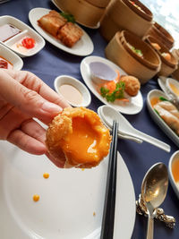 Close-up of hand holding food