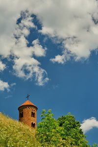Low angle view of church tower against sky