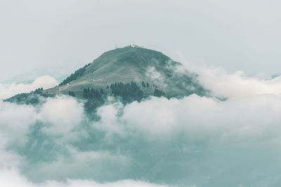 Low angle view of snowcapped mountain against sky