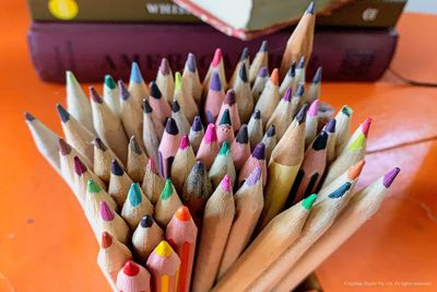 High angle view of multi colored pencils on table