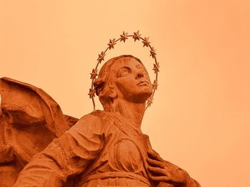 Low angle view of statue against sky