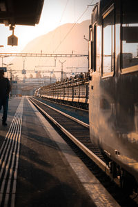 Train at railroad station platform against sky