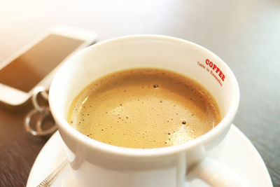 High angle view of coffee cup on table