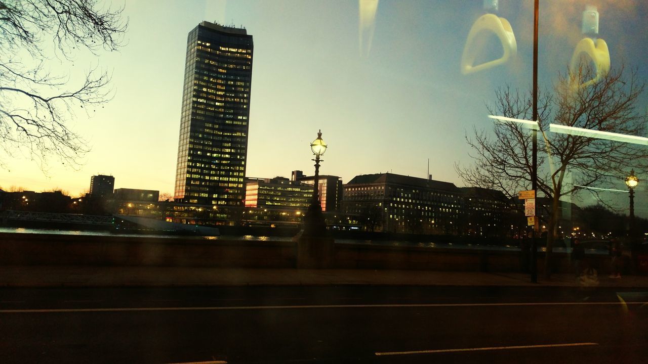 VIEW OF SKYSCRAPERS AT SUNSET