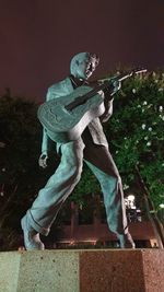 Low angle view of statue against sky