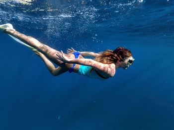 Woman swimming in sea