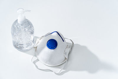 Close-up of glass bottle against white background