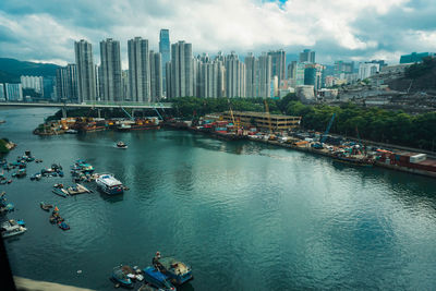 High angle view of river and buildings in city