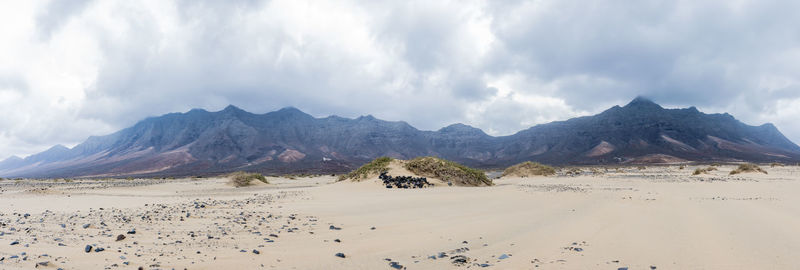 Panoramic view of desert against sky