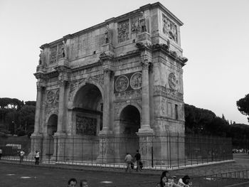 People in front of historical building