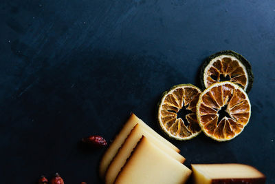 High angle view of hand holding fruit on table