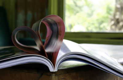 Close-up of heart shape on book 