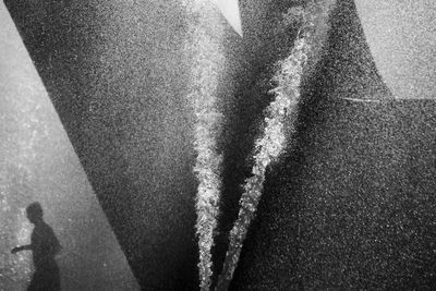 High angle view of person standing on road