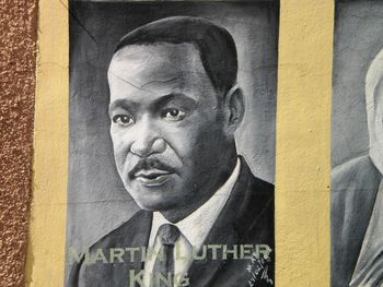 Close-up portrait of man against wall