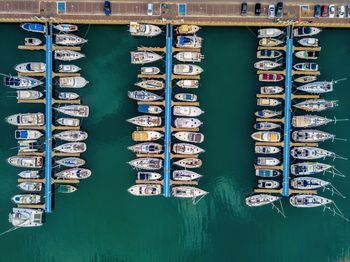 Aerial view of ships moored at harbor