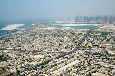 High angle view of city buildings against sky