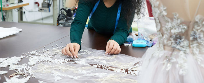 Midsection of woman standing at home