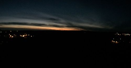 Scenic view of landscape against sky at night