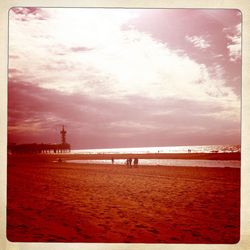 Scenic view of sea against cloudy sky