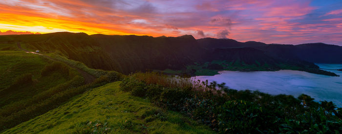 Scenic view of landscape against sky during sunset