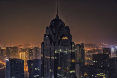 Modern buildings in city at night