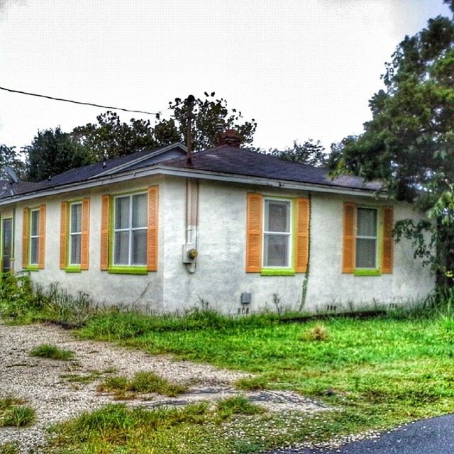 architecture, building exterior, built structure, window, house, grass, residential structure, tree, residential building, abandoned, old, sky, day, clear sky, exterior, facade, outdoors, field, no people, building