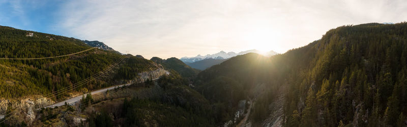 Panoramic view of land and mountains against sky