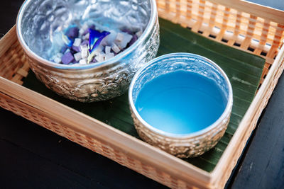 High angle view of multi colored glass on table