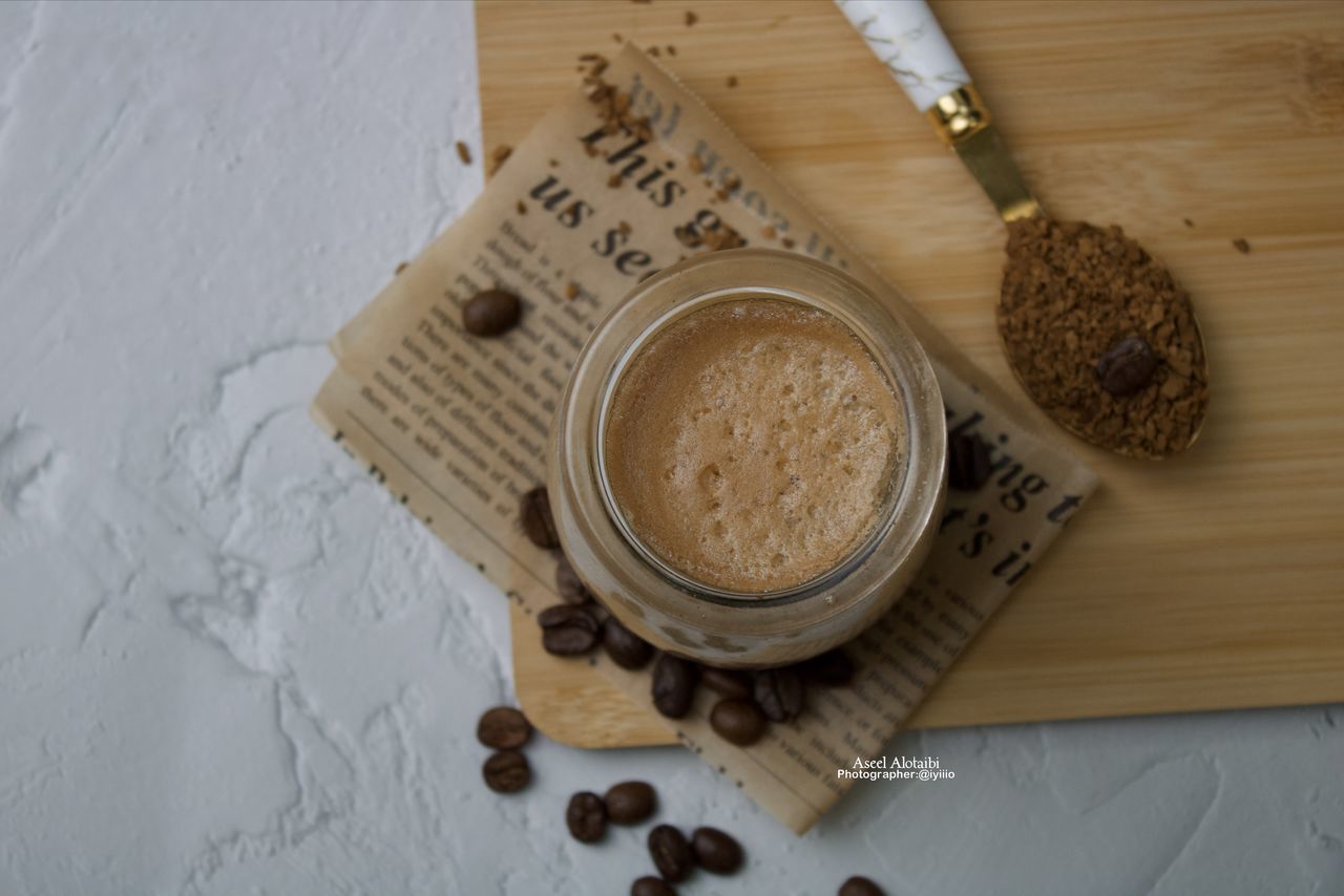 food and drink, high angle view, food, indoors, drink, wood, coffee, freshness, still life, refreshment, directly above, table, no people, kitchen utensil, wellbeing, healthy eating, spoon, cup, studio shot, ingredient, eating utensil, mug