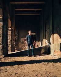 Full length of woman standing in old building