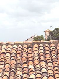 Roof tiles against sky