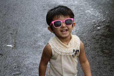 Portrait of a boy standing on sand