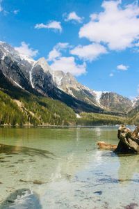 Scenic view of lake against cloudy sky