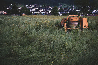 Abandoned tractor on field