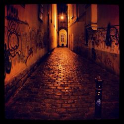 Illuminated alley at night