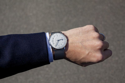 Close-up of human hand against the wall