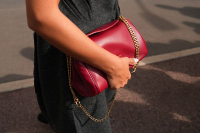 Midsection of woman standing outdoors