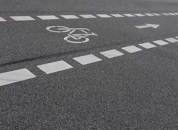 High angle view of arrow symbol on road