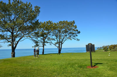 Scenic view of sea against clear blue sky