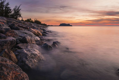 Scenic view of sea against sky during sunset