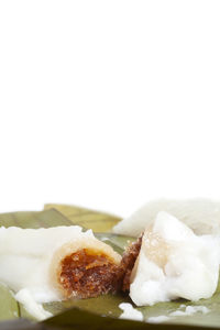 Close-up of ice cream over white background