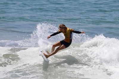 Full length of man surfing in sea