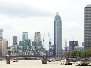 Modern buildings in city against sky