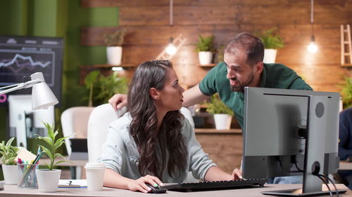 Business colleagues talking at office